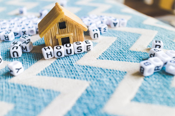 Miniature house model with "HOUSE" alphabet cube letter - Photo, Image