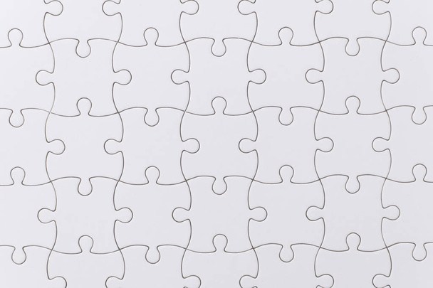 close up white jigsaw puzzle texture - Foto, afbeelding