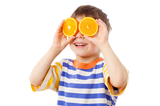 Funny boy with fruits on eyes - Fotoğraf, Görsel