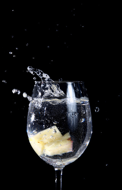 Pineapple pieces falling in water - Photo, image