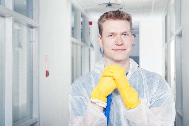 Cleaning office in protective overalls - Fotoğraf, Görsel