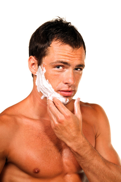 Young handsome man shaving - Zdjęcie, obraz