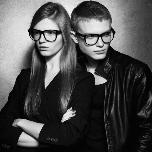 Portrait of gorgeous fashion twins in black clothes wearing tren - Photo, image