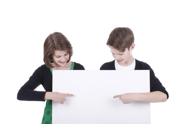 Portrait of a boy and a girl with a white placard - Zdjęcie, obraz