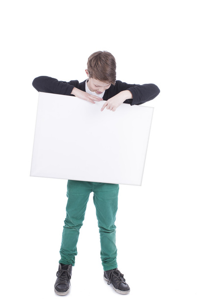 Portrait of a boy with a white placard - Zdjęcie, obraz