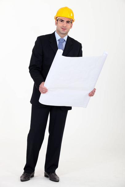 businessman holding a blueprint - Zdjęcie, obraz