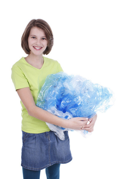 Portrait of a girl with a bag of trash - Φωτογραφία, εικόνα