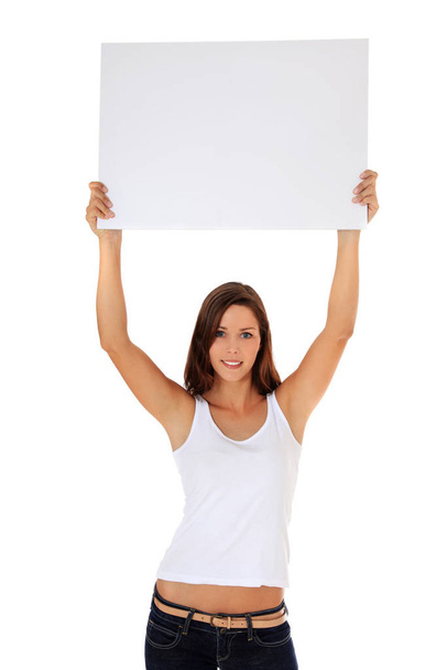 Attractive young woman holding blank white sign. All on white background. - Фото, изображение