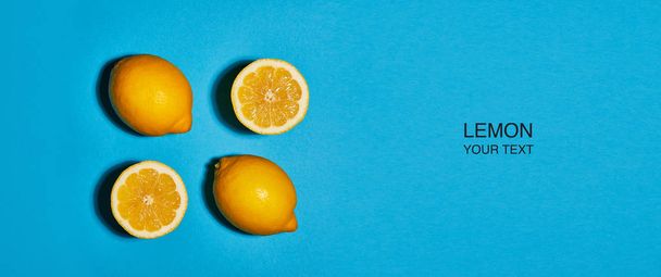 Diseño creativo hecho de limón sobre fondo azul. Piso tendido, vista superior, espacio para copiar. Concepto alimenticio
. - Foto, Imagen