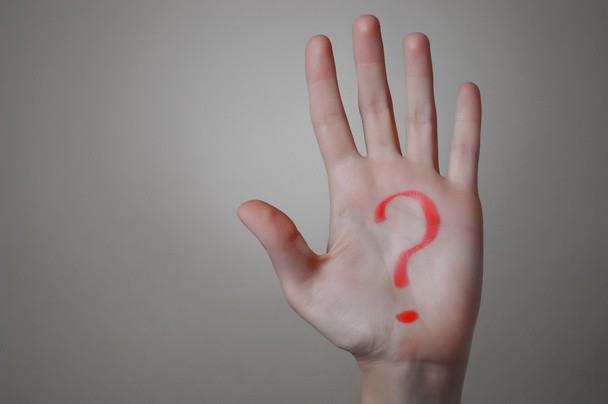 Червоний знак питання на руці
 - Фото, зображення