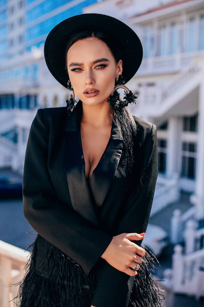 beautiful sexy woman with dark hair in luxurious clothes - Valokuva, kuva