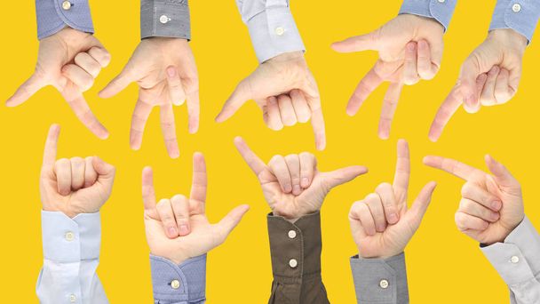 Différents gestes de mains masculines entre elles sur une ba jaune
 - Photo, image