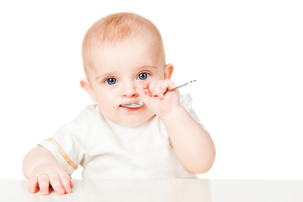 Beautiful babe eats with a spoon - Zdjęcie, obraz