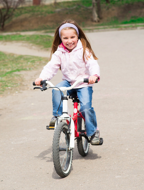 little girl with her bicycle - Photo, Image