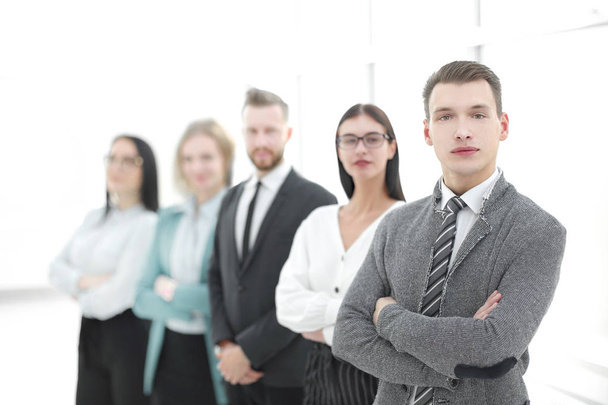 young businessman standing in front of his business team - Foto, imagen