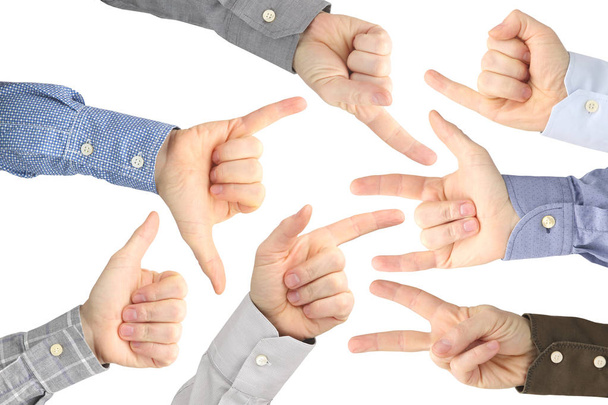 Verschillende gebaren van mannelijke handen tussen elkaar op een witte BAC - Foto, afbeelding