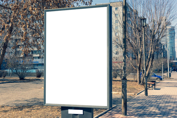 Vertical small billboard in the city on the sidewalk. Mock up for your advertising or announcements - Photo, Image