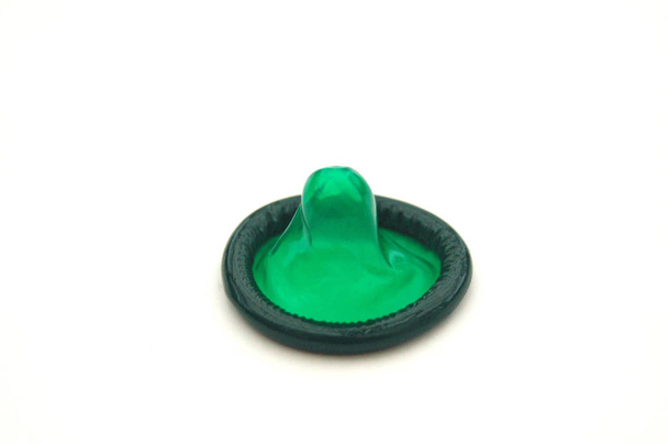 Bright Green Condom on White Background - Fotografie, Obrázek