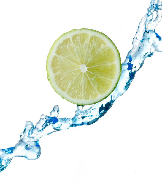 Lime and water splash on a white background - Foto, immagini