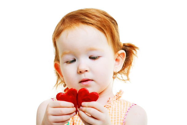 little girl with two little red heart - 写真・画像