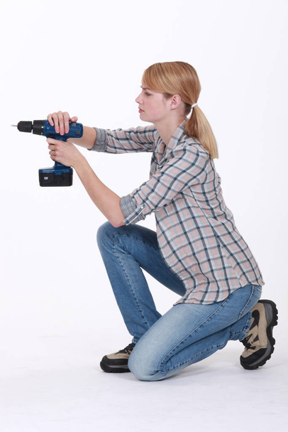 Female drilling isolated on white background - Photo, Image