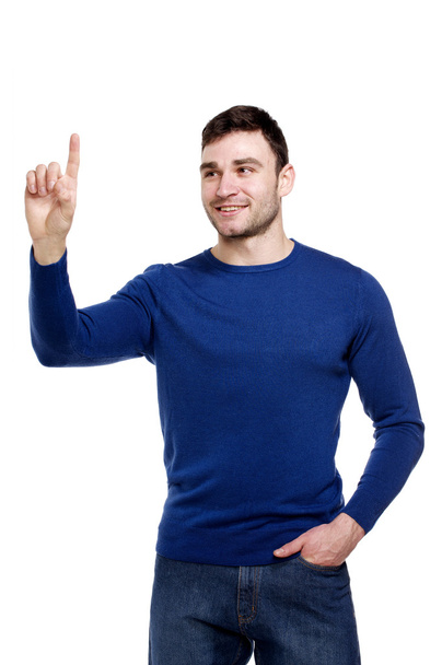 Smiling man pointing, isolated on a white background - Photo, Image