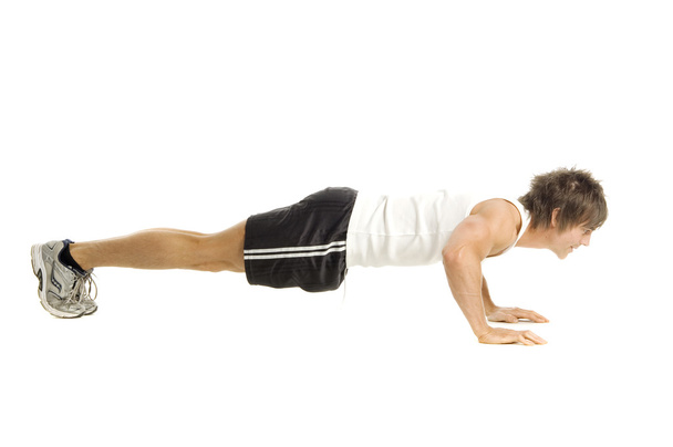Man working out isolated on a white background - Photo, Image