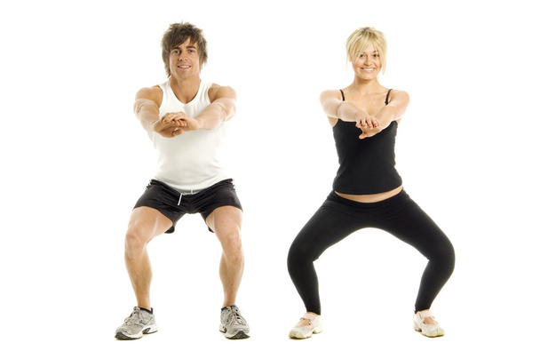 Man and woman working out isolated on a white background - Foto, imagen