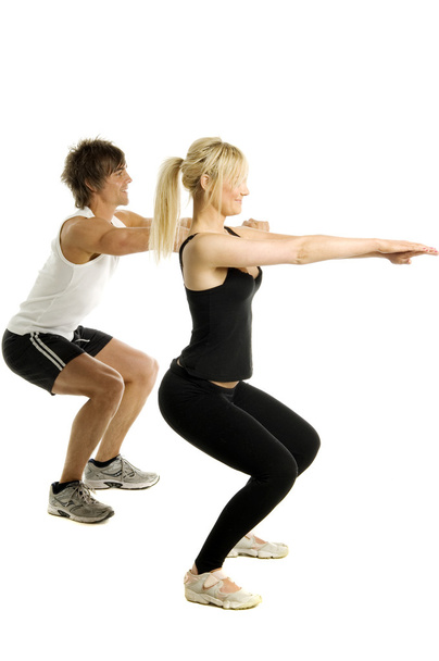 Man and woman working out isolated on a white background - Foto, Bild