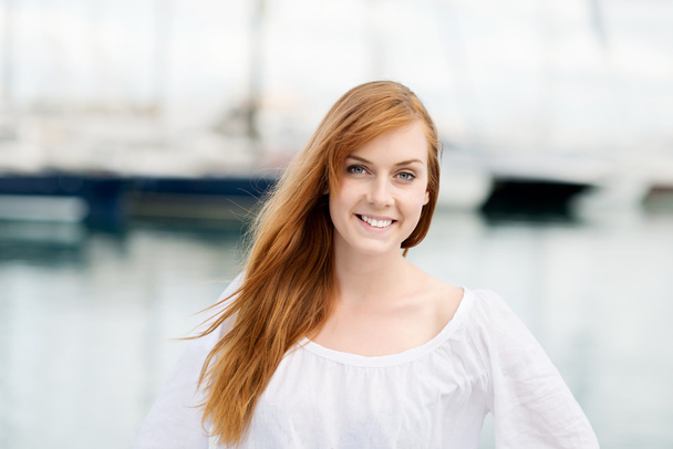 Pretty young woman at the harbour - Photo, Image
