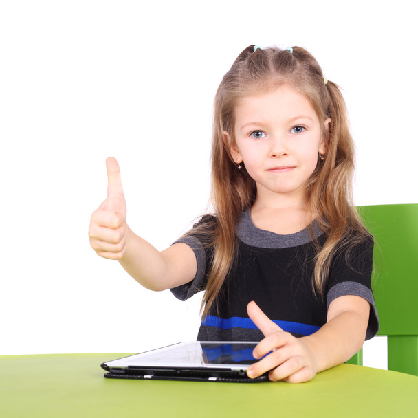 little girl using tablet PC - Fotó, kép