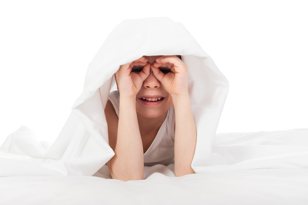 cheerful boy hiding under blanket - Photo, Image