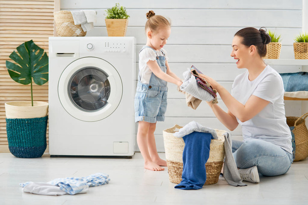 family doing laundry - Фото, зображення