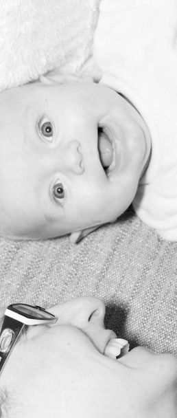 Beautiful newborn baby boy with his mother, complicity, happiness, black and white - Zdjęcie, obraz
