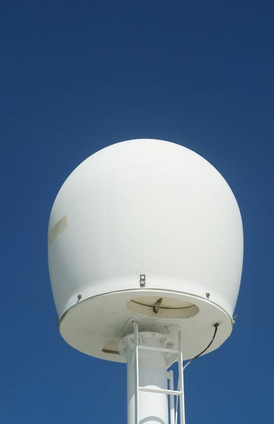 Antenna dome for satellite navigation system onboard a ship - Fotoğraf, Görsel
