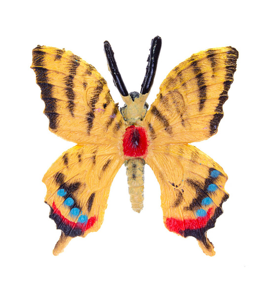 Іграшка-метелик на білому тлі
 - Фото, зображення