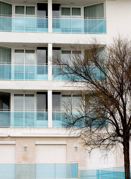 Modern Apartment Building with Blue Glass Facade and Balcony closeup Outdoors - Valokuva, kuva