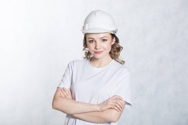 Young architect woman in white safety helmet hardhat on white background. - Photo, Image