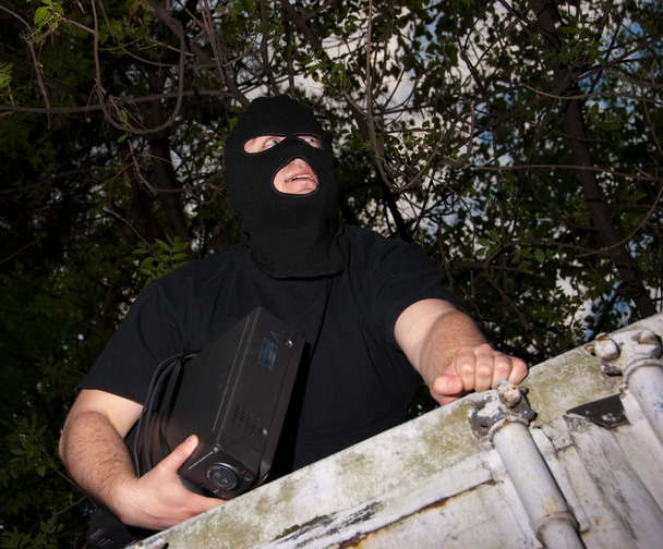 κλέφτης σε μια μάσκα - Φωτογραφία, εικόνα