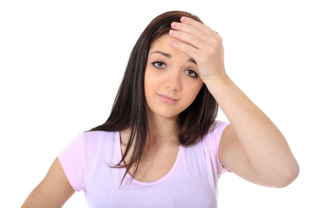 Attractive teenage girl suffering from a headache. All on white background. - Photo, Image