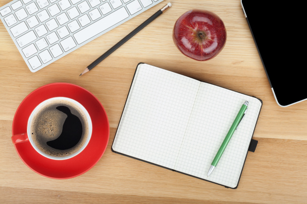 Coffee cup, red apple and office supplies - Photo, Image
