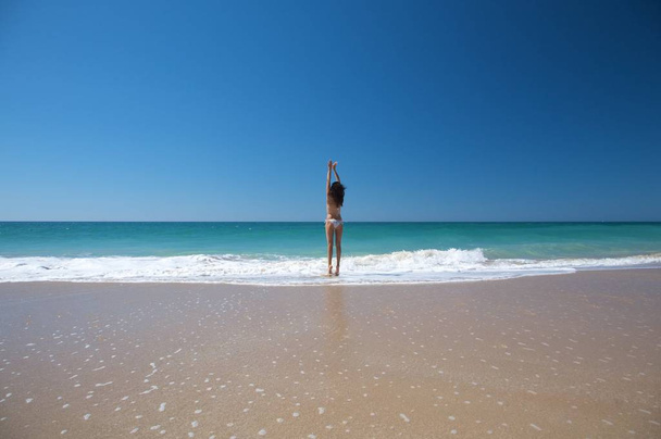woman bikini dressed at el palmar beach in cadiz spain - Фото, изображение