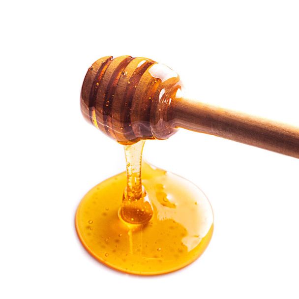 Honey drip isolated on white background - Fotoğraf, Görsel