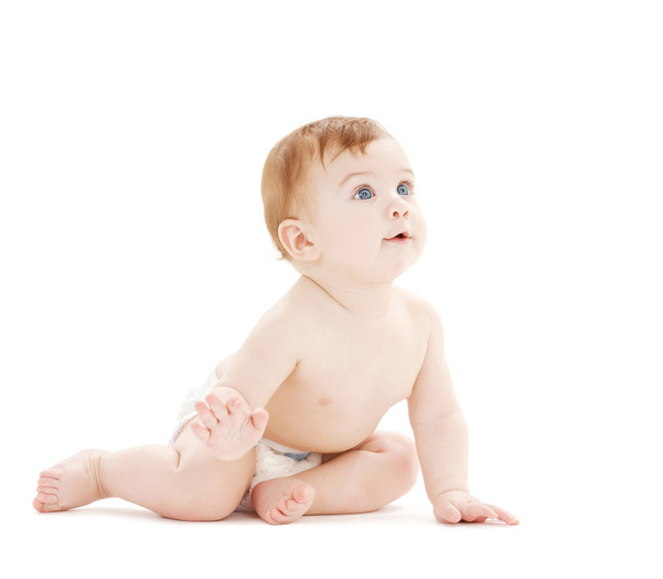 bright picture of crawling curious baby over white backgroubd - Photo, Image