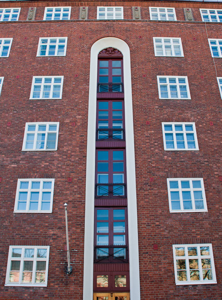 Big red wall with sky blue windows - Zdjęcie, obraz