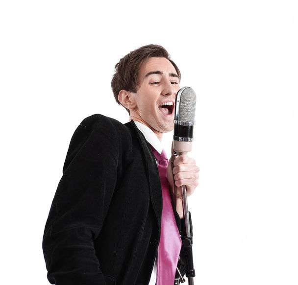 stylish guy with a microphone singing jazz - Фото, изображение