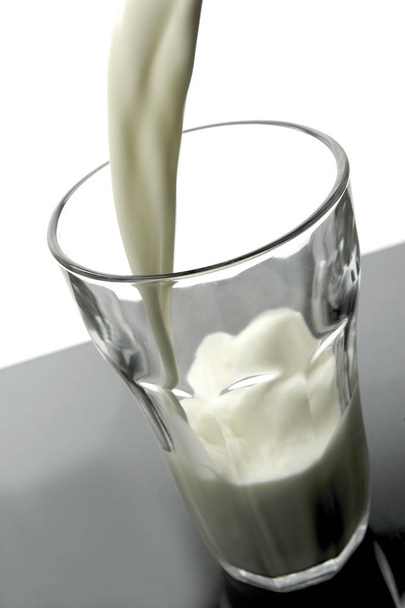 Glasses of milk isolated against a white background - Fotó, kép