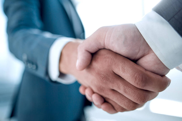 Close up of businessmen shaking hands business success ideas concept - Photo, image