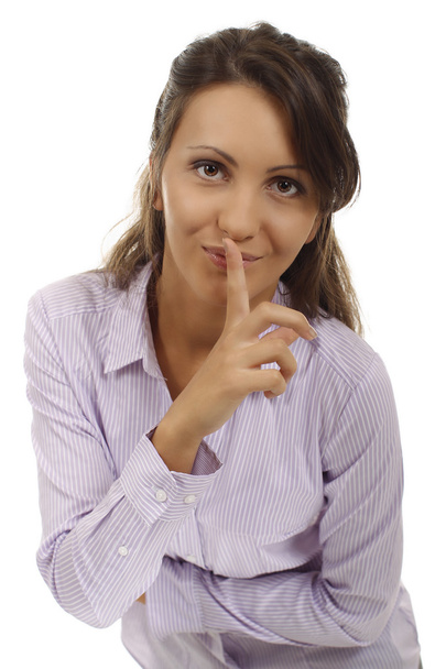 Business woman put a finger on her lipps - Photo, image