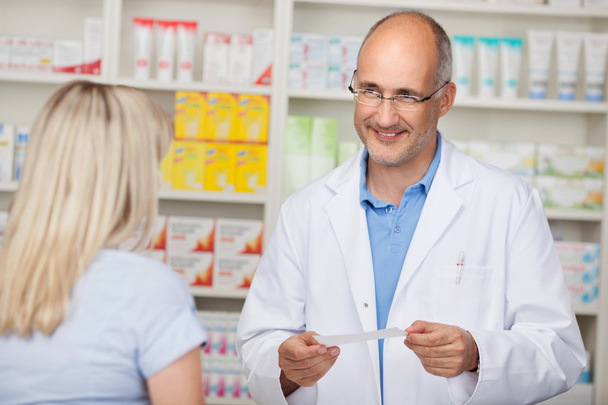 confident mature pharmacist in customer interview - Foto, Imagen